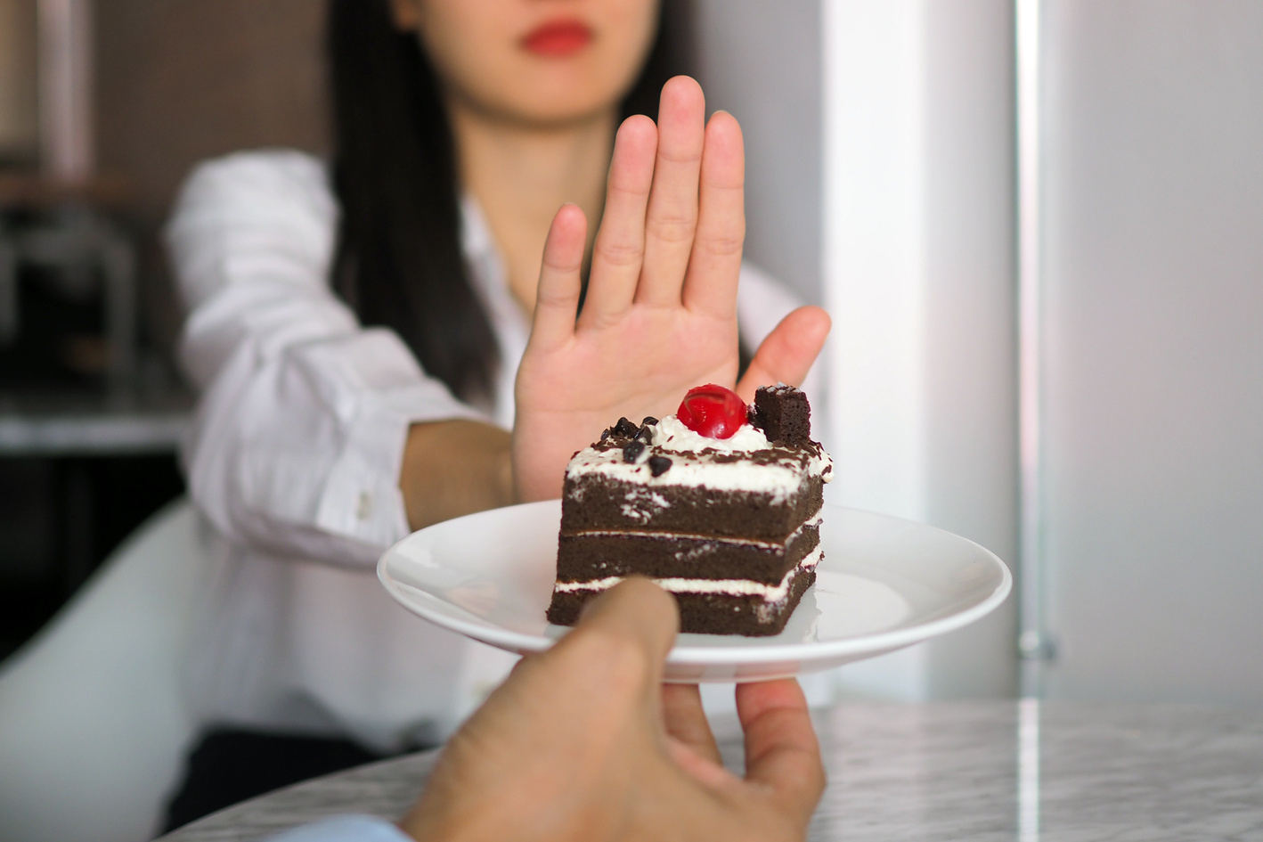 Woman Resisting Chocolate Cake